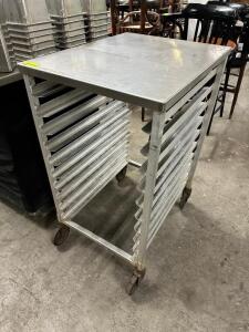 DESCRIPTION: 30" X 24" ROLL ABOUT STAINLESS TABLE W/ UNDER COUNTER TRAY RACK. LOCATION: BAY 6 QTY: 1