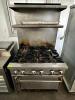 DESCRIPTION: JADE RANGE SIX BURNER RANGE W/ LOWER OVEN BRAND / MODEL: JADE RANGE ADDITIONAL INFORMATION NATURAL GAS. W/ TWO TIER STAINLESS OVER SHELF - 3