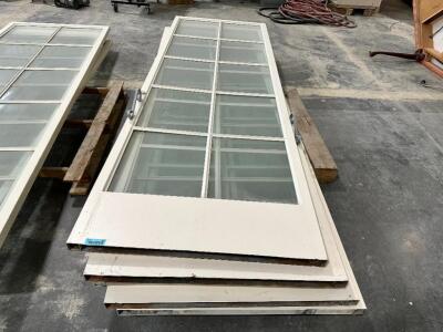 (4) 9' X 35.5' WHITE DOORS W/ GLASS CENTER INSERTS.