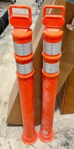 (7) ORANGE BARRIER POSTS.