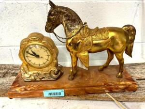 DESCRIPTION: VINTAGE HORSE CLOCK INFORMATION: CLOCK WORKS BUT NEEDS NEW PLUG SIZE: 17"X12" QTY: 1