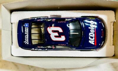 DESCRIPTION: 1999 LIMITED EDITION DALE EARNHARDT JR. MODEL CAR MONTE CARLO SIZE: 10"X4" QTY: 1