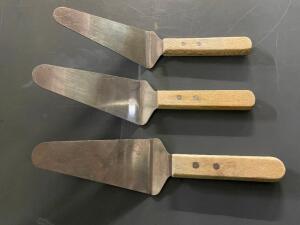 (24) STAINLESS PIE SERVERS W/ WOODEN HANDLES