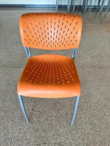 (21) ORANGE PLASTIC STACKING DINING HALL CHAIRS
