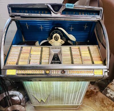 DESCRIPTION: WURLITZER JUKE BOX INFORMATION: PLAYS OF IPHONE WITH ORIGINAL SPEAKERS, GLASS BROKEN, SOUNDS GREAT SIZE: 4'3"X33"X28" QTY: 1