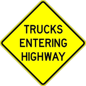 (2) TRUCKS ENTERING HIGHWAY SIGN