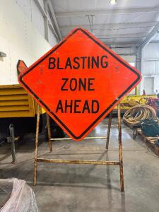 (2) BLASTING METAL ZONE ROAD SIGNS