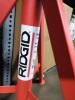 DESCRIPTION: (1) ADJUSTABLE PIPE STAND WITH ROLLER BRAND/MODEL: RIDGID #74799305 INFORMATION: RED SIZE: 12" RETAIL$: $200.00 EA QTY: 1 - 3