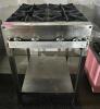 FOUR BURNER GAS RANGE W/ STAND.