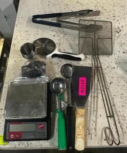 SMALL DIGITAL SCALE AND ASSORTED UTENSILS.