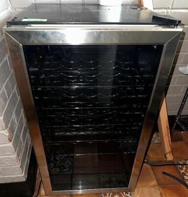 DESCRIPTION: INSIGNIA 29 BOTTLE WINE COOLER IN STAINLESS BRAND / MODEL: INSIGNIA NS-WC29SS9 ADDITIONAL INFORMATION RETAILS NEW FOR $320 LOCATION: KITC