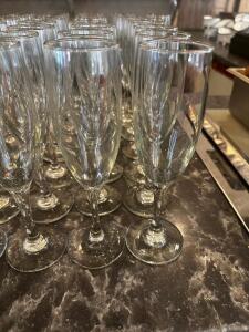 DESCRIPTION: (28) CHAMPAGNE FLUTES LOCATION: UPSTAIRS THIS LOT IS: SOLD BY THE PIECE QTY: 28