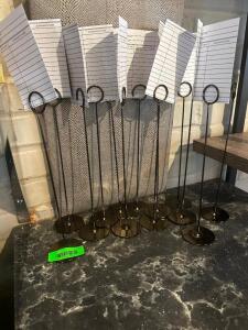 DESCRIPTION: (12) STAINLESS TABLE NUMBER POSTS. LOCATION: UPSTAIRS THIS LOT IS: SOLD BY THE PIECE QTY: 12