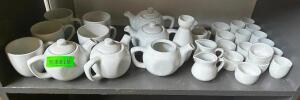 DESCRIPTION: (1) LOT OF ASSORTED CERAMIC TEA KETTLES, CREAMER DECANTERS, AND SAKE CUPS LOCATION: BAR / MAIN FLOOR THIS LOT IS: ONE MONEY QTY: 1