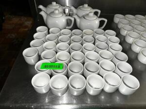 DESCRIPTION: (2) CHINA PITCHER AND (1) LOT OF SAKE CUPS LOCATION: KITCHEN THIS LOT IS: ONE MONEY QTY: 1