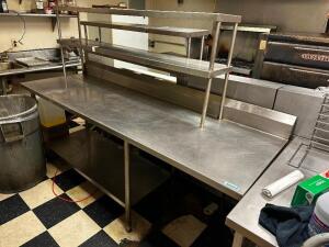 DESCRIPTION: 90" X 30" ALL STAINLESS TABLE W/ LEFT SIDE RISER SHELF. SIZE 90" X 30" LOCATION: KITCHEN QTY: 1