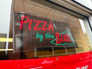 DESCRIPTION: " PIZZA BY THE SLICE " LIGHT BOX SIGN ADDITIONAL INFORMATION LOT INCLUDED DRY ERASE BOARD AND LED LIGHT ROPE " RED " LOCATION: FRONT THIS