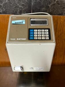 DESCRIPTION: AMANO MJR7000 TIME CLOCK BRAND / MODEL: AMANO MJR7000 LOCATION: KITCHEN QTY: 1