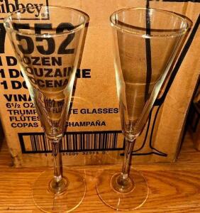 DESCRIPTION: (12) TRUMPET FLUTE GLASSES LOCATION: MAIN SEATING THIS LOT IS: SOLD BY THE PIECE QTY: 12