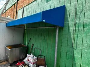 DESCRIPTION: 72" BLUE FABRIC AWNING W/ METAL FRAME LOCATION: OUTSIDE QTY: 1