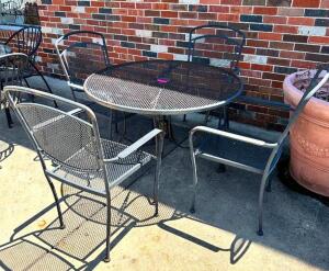 DESCRIPTION: WROUGHT IRON TABLE W/ 4 CHAIRS LOCATION: FRONT PATIO QTY: 1