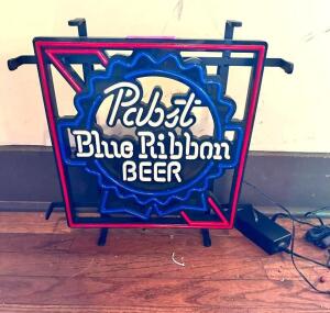 DESCRIPTION: PBR NEON SIGN INFORMATION: WORKING CONDITION UNKNOWN, MISSING PART OF POWER CORD LOCATION: BAR QTY: 1