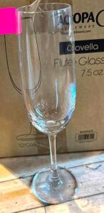 DESCRIPTION: (2) CASES OF FLUTE GLASSES INFORMATION: 12 GLASSES PER CASE LOCATION: MAIN DINING QTY: 2