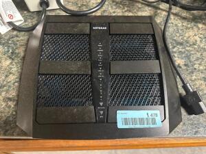 DESCRIPTION: NETGEAR ROUTER W/ POWER CORD LOCATION: BAY 6 QTY: 1