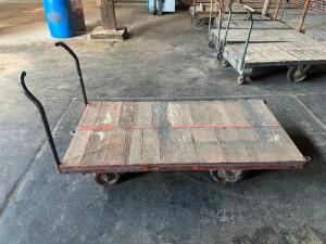 DESCRIPTION: 72" WOODEN WAREHOUSE CART ADDITIONAL INFORMATION W/ HEAVY DUTY CAST IRON WHEELS LOCATION: WAREHOUSE QTY: 1