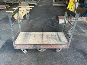 DESCRIPTION: 60" HEAVY DUTY WAREHOUSE CART W/ HAND RAIL ADDITIONAL INFORMATION W/ HEAVY DUTY CAST IRON WHEELS LOCATION: WAREHOUSE QTY: 1