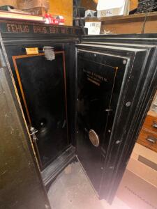 DESCRIPTION: 64" X 27" HALL SAFE AND FIXTURE HEAVY DUTY VINTAGE SAFE ADDITIONAL INFORMATION W/ KEY. LOCATION: DOWNSTAIRS OFFICE QTY: 1