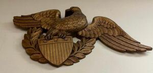 DESCRIPTION: HAND CARVED WOODEN EAGLE W/ SHIELD LOCATION: DOWNSTAIRS OFFICE QTY: 1