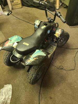 DESCRIPTION: (1) CHILDREN'S BATTERY POWERED ATV INFORMATION: MAY NEED WORK BUT FUNCTIONS PERFECTLY, CHARGER INCLUDED QTY: 1