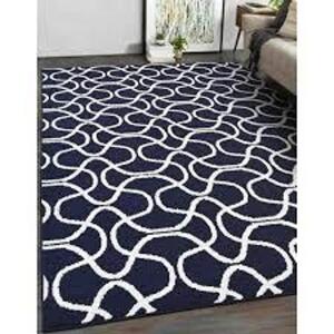 DESCRIPTION: (1) AREA RUG BRAND/MODEL: MAINSTAYS INFORMATION: NAVY CIRCLE SIZE: 5X7 RETAIL$: $31.16 EA QTY: 1