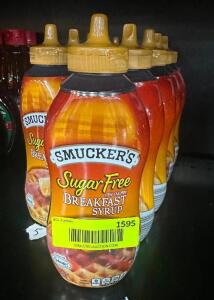 (11) BOTTLES OF SMUCKER'S SUGAR FREE SYRUP