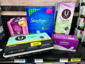 (6) ASSORTED PACKS OF FEMININE HYGIENE PRODUCTS.