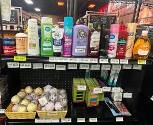 (1) LOT OF ASSORTED BATH PRODUCTS - CONTENTS OF (2) SHELVES.