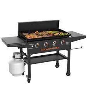 DESCRIPTION: (1) PROPANE GAS GRILL GRIDDLE COOKING STATION WITH FOLDING SHELVES BRAND/MODEL: BLACKSTONE #1863 INFORMATION: BLACK SIZE: 36", 4 BURNER R