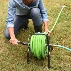 DESCRIPTION: (1) HANDY REEL WITH HOSE BRAND/MODEL: YARD BUTLER #IHR-1SLV INFORMATION: BLACK WITH GREEN HOSE SIZE: 50' HOSE, 5/8" DIAMERE RETAIL$: $132