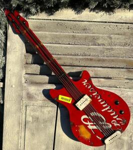 DESCRIPTION: METAL BUDWEISER GUITAR SIZE: 36"X32" QTY: 1