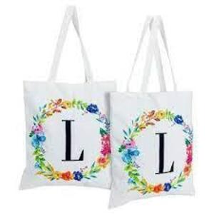 DESCRIPTION: (4) MONOGRAMMED CARRY BAGS BRAND/MODEL: OKUNA OUTPOST INFORMATION: WHITE WITH FLOWERS RETAIL$: $13.99 EA QTY: 4