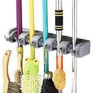 DESCRIPTION: (2) MOP AND BROOM HOLDER INFORMATION: GRAY, PLASTIC SIZE: 5 POSITIONS, 6 HOOKS RETAIL$: $38.95 EA QTY: 2