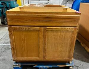 PALLET W/ TWO OAK CABINETS