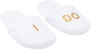 DESCRIPTION: (4) PAIRS OF BRIDAL SLIPPERS BRAND/MODEL: SPARKLE AND BASH INFORMATION: GOLD PRINTED: "I DO " SIZE: WHITE RETAIL$: $7.00 EA QTY: 4