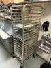 TWENTY PAN TRAY RACK ON CASTERS.