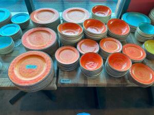 (1) LOT OF ORANGE CERAMIC DINNER PLATES , BOWLS, AND BREAD PLATES