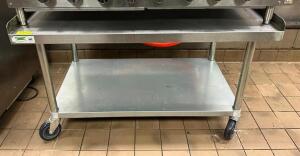 DESCRIPTION: 48" EQUIPMENT STAND ON CASTERS BRAND/MODEL: REGENCY LOCATION: KITCHEN QTY: 1