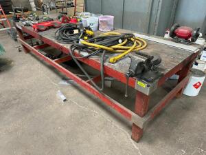 10' X 4' HEAVY DUTY WOODEN FABRICATION TABLE W/ MOUNTED VICE AND BENCH GRINDER.