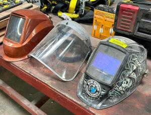 (2) WELDING HOODS AND ONE SAFETY VISOR.