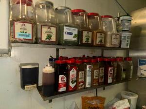 CONTENTS OF SHELF - ASSORTED SPICES AND SEASONINGS